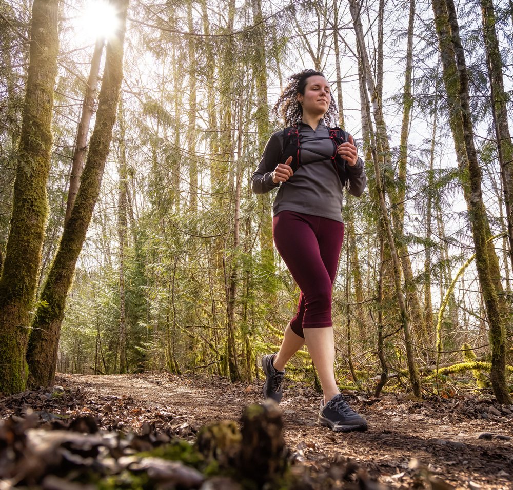 A runner on a forest trail